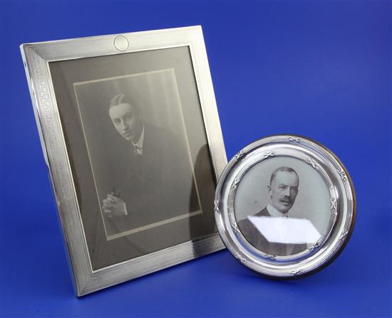 Two silver photo frames.